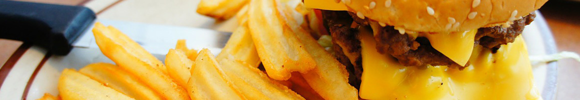 Eating American (Traditional) Burger at McKenzie's Burger Garage restaurant in Lawton, OK.